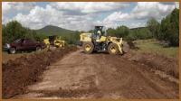 Grading equipment working on a WWR ranch road